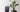 Grouping of three tapered square planters Athena planters in black, in three sizes, one with a green leafy plant inside.