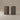 Two minimalist rectangular planter pots with a textured matte finish, one in dark brown and the other in charcoal gray, set against a warm beige studio background.